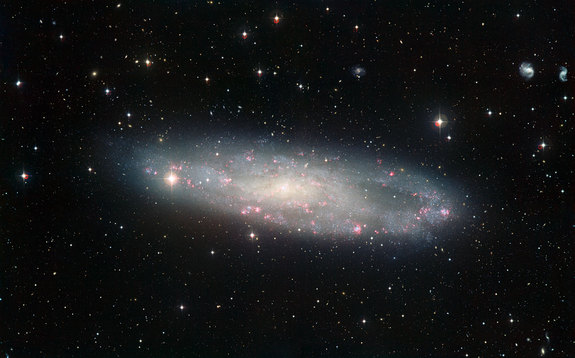 dusty-spiral-galaxy-is-closer-than-once-thought