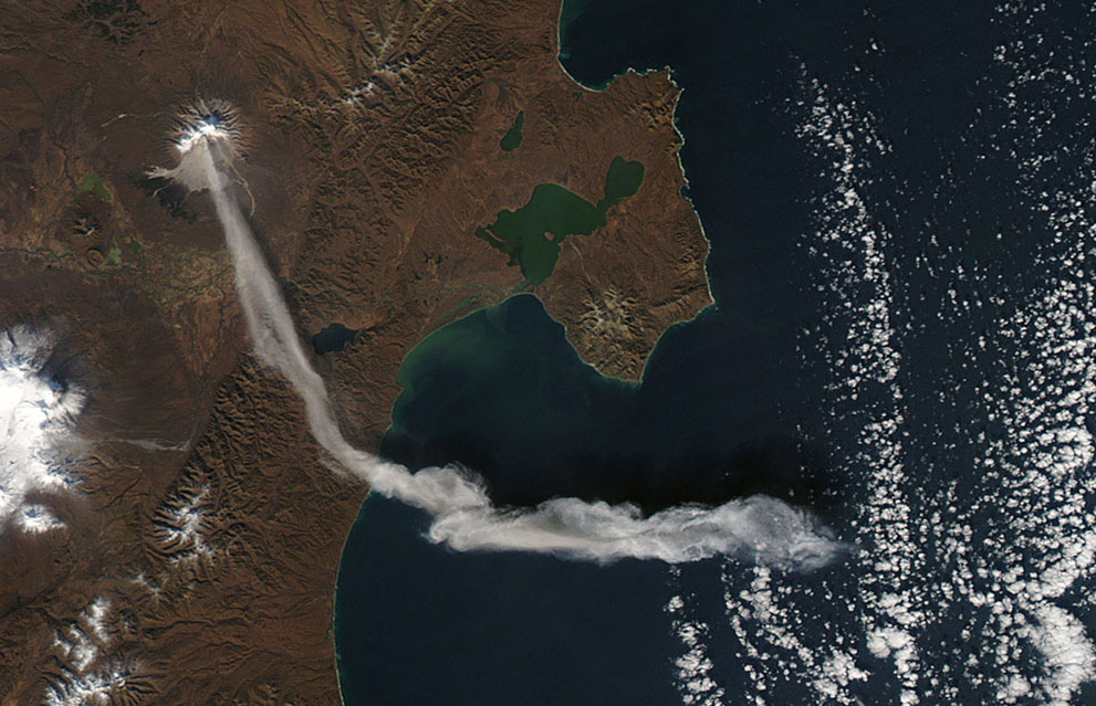 Shiveluch Volcano, on Russia's Kamchatka Peninsula, erupted on October 6, 2012, sending a plume of ash high into the air, carried first south, then east, as winds shifted. Shiveluch is one of the biggest and most active volcanoes on the Kamchatka Peninsula. (NASA/Jeff Schmaltz, LANCE MODIS Rapid Response Team)