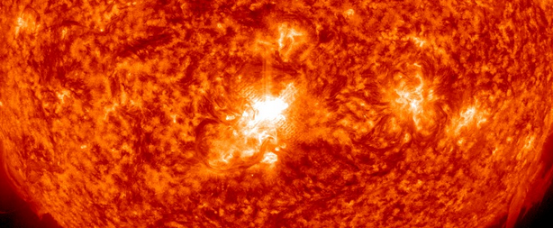 Impulsive solar flare reaching M6.3 erupted from central region on the Sun