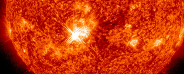 Major solar flare peaking as X1.1 erupted with Earth directed component