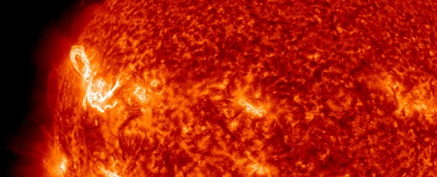 Long duration M1.4 solar flare erupted near the northeast limb