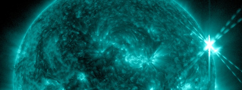 Impulsive M8.2 solar flare erupts off northwestern limb