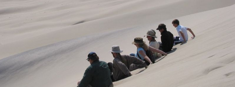 Science behind “booming” and “burping” sand dunes explained