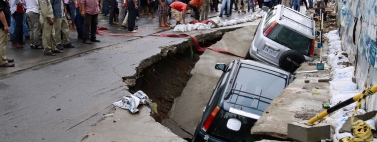 Heavy monsoon rain opens a large sinkhole in a busy road in Phnom Penh, Cambodia