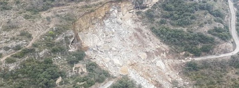 Huge rockslide in Castell de Mur buries a vehicle after heavy rainfall, Spain