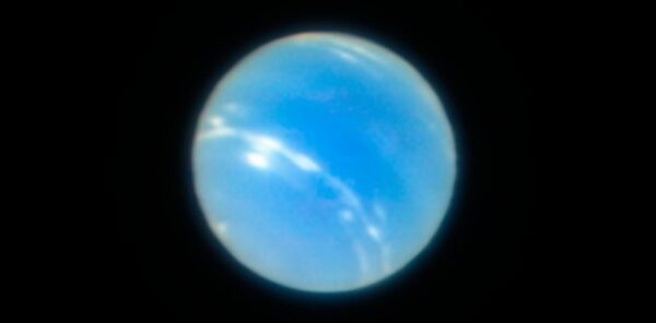 Global temperatures at Neptune unexpectedly cooled over the past 20 years