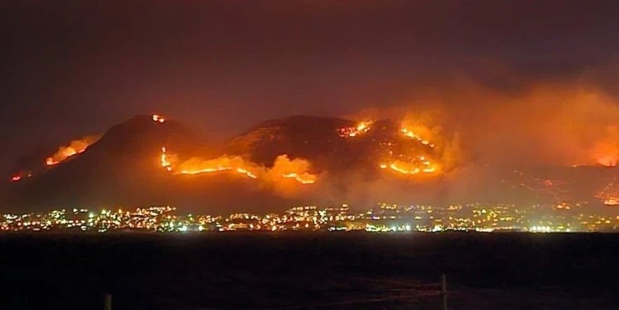 Firefighters battle wildfire near Cape Town, South Africa's naval base at risk