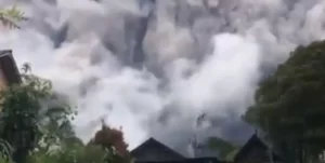 Large pyroclastic flow at Merapi volcano, ashfall blankets nearby communities, Indonesia