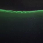 Rare aurora curls captured over Kerid Crater in Iceland