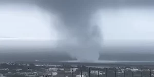 Large waterspout makes landfall in Okinawa, damaging several buildings, Japan