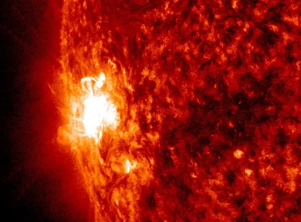 Strong M6.7 solar flare erupts from emerging region on SE limb