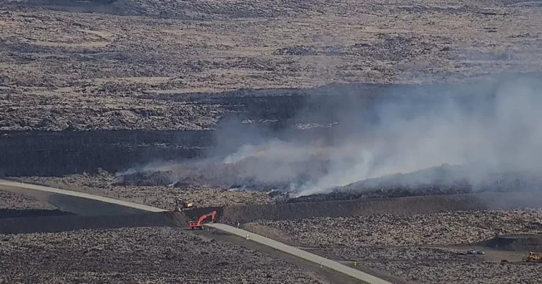 Lava crosses Grindavíkurvegur road near Grindavik, Iceland june 2024