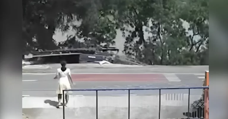 Security camera captures landslide dragging vehicles into a river, Thailand