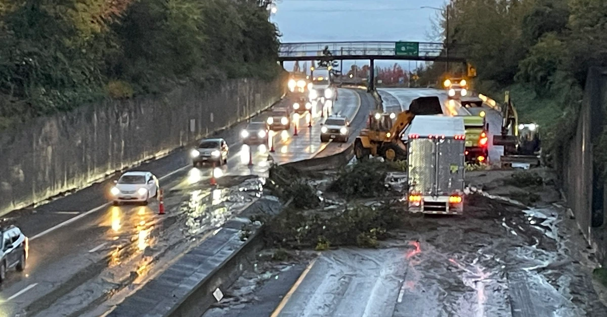 Vehicles stuck in debris after a landslide struck Interste-5 highway.