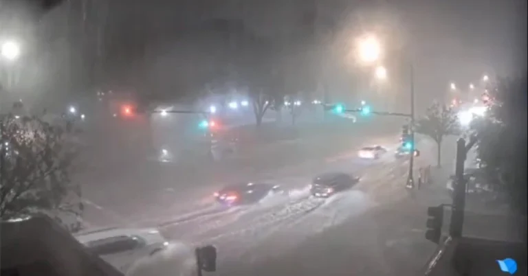 vehicles wading through flooded streets of Rosewell in Chaves County, New Mexico