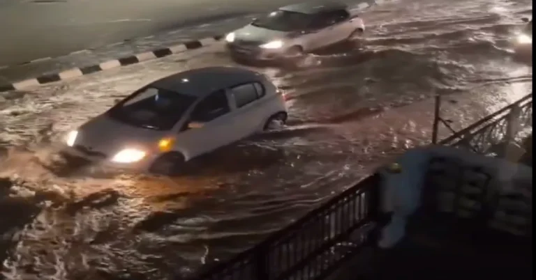 Cars wading through flooded streets in Paphos, Cyprus after a storm on November 2, 2024.