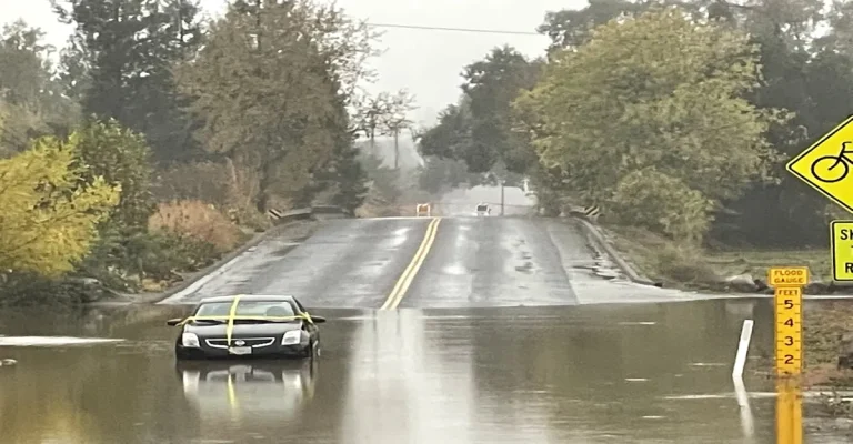 Vehicle stranded on the street after floods triggered by Atmospheric River