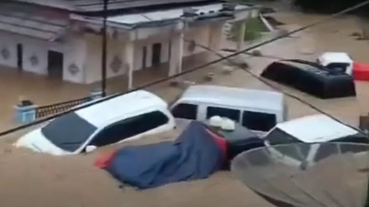 Vehicles submerged by floodwaters in Indonesia