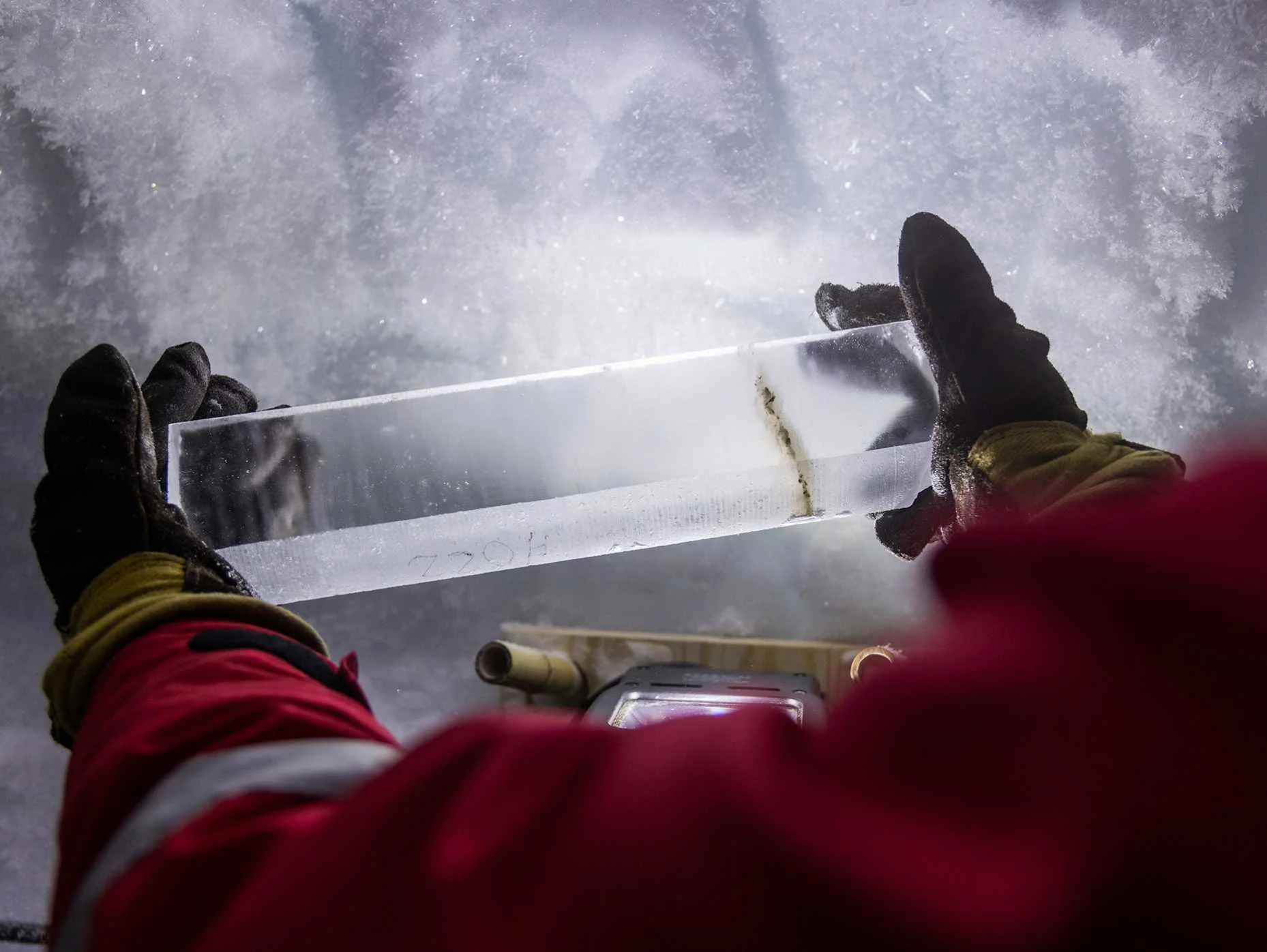 A part of an ice core taken from the borehole that the researchers drilled into the ice