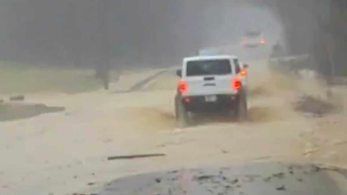 Vehicle traversing through floodwaters on Highway 25, near cotton town Tennessee on Saturday, February 15, 2025.