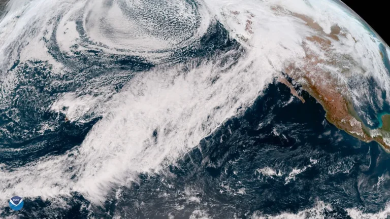 Satellite image shows an atmospheric river stretching across the Pacific toward California, delivering heavy rain and snow across the region.