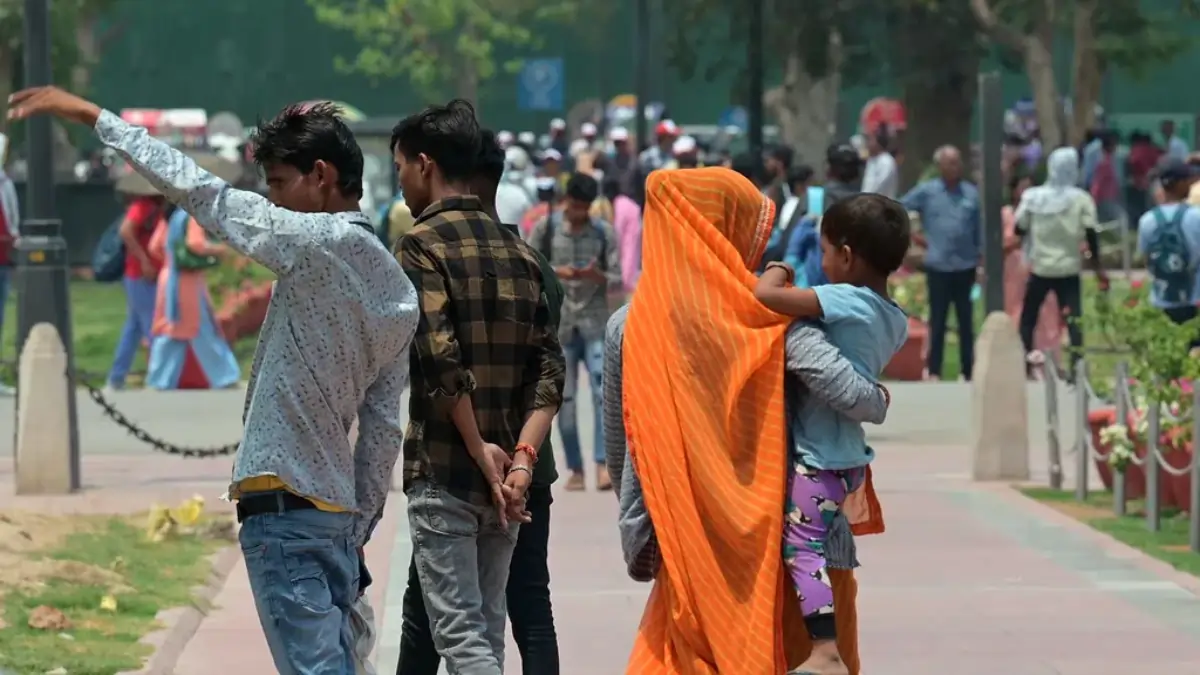 People cover their heads with scarves and cloth to shield themselves from extreme heat.