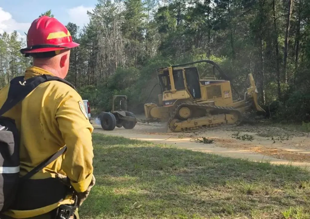 Bulldozers help contain a wildfire in the Ocala National Forest last week. Credit: United States Forest Service