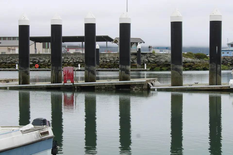 Sections of a structurally compromised dock at Crescent City's harbor sink into the water, a result of the damage from the recent tsunami. 
