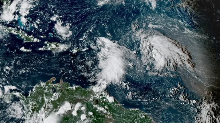 satellite image showing two tropical waves in atlantic ocean at 1940 utc on september 23 2025