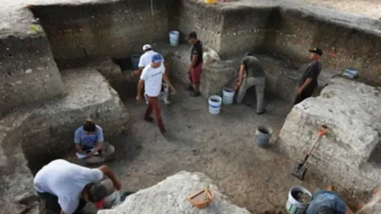 Archaeologists excavating the cruciform, before discovering the cache in the center of the pit.