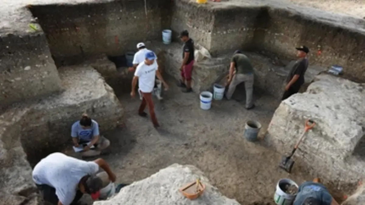 Archaeologists excavating the cruciform, before discovering the cache in the center of the pit.