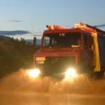 A firetruck driving through floodwaters in Attica, Greece, on January 21, 2026. Credit: Hellenic Fire Corps