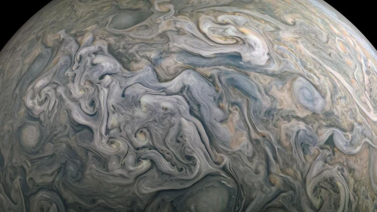 Gigantic storms swirl across the surface of Jupiter