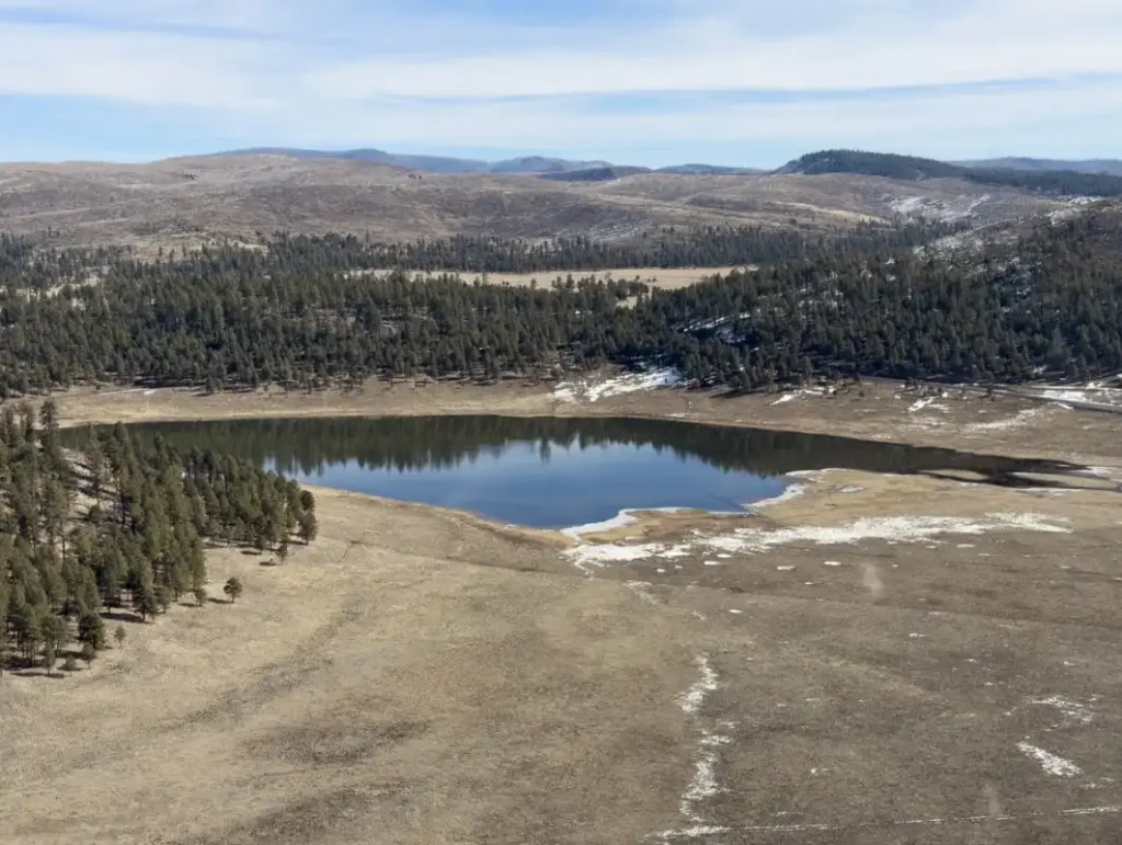 Lake Sierra Blanca in the Upper Black River watershed at 8,500 feet surrounded by Ponderosa pine