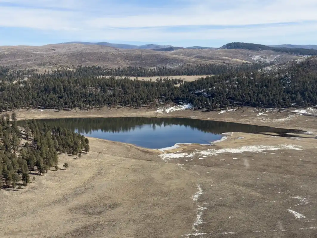 Lake Sierra Blanca in the Upper Black River watershed at 8,500 feet surrounded by Ponderosa pine