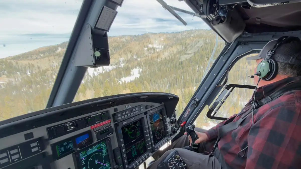 Rob Ackerman, a helicopter pilot for Salt River Project, flies west of Mount Baldy in eastern Arizona.