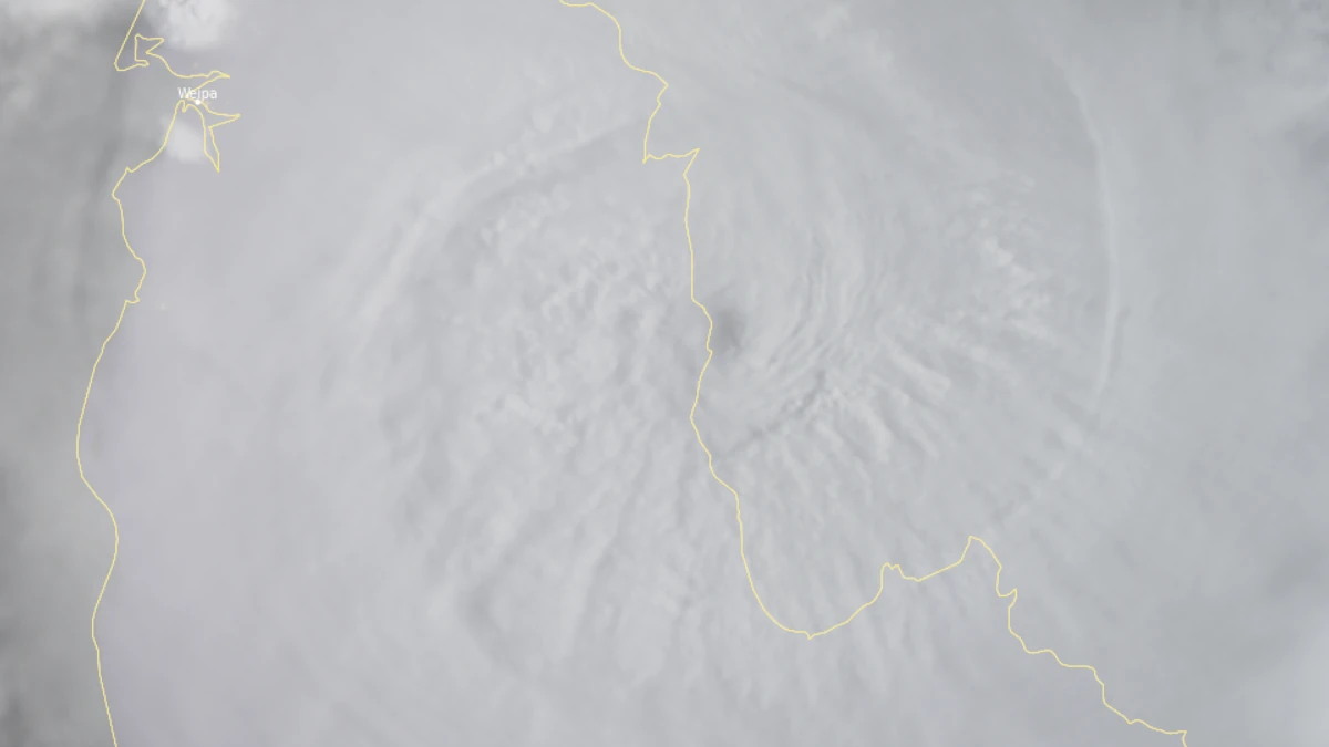 Satellite image of tropical cyclone Narelle's eyewall beginning landfall over the Queensland Coast at 0700 AEST on March 20 (2100 UTC on March 19), 2026