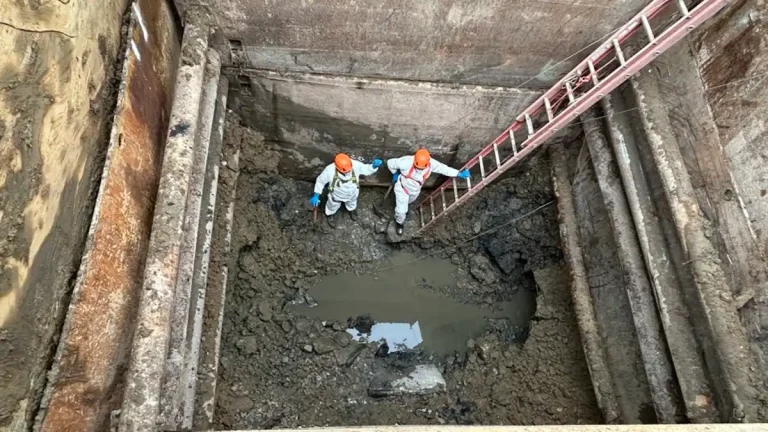 Workers inspect the collapsed section of the Potomac Interceptor sewer line during repair operations in Montgomery County, Maryland