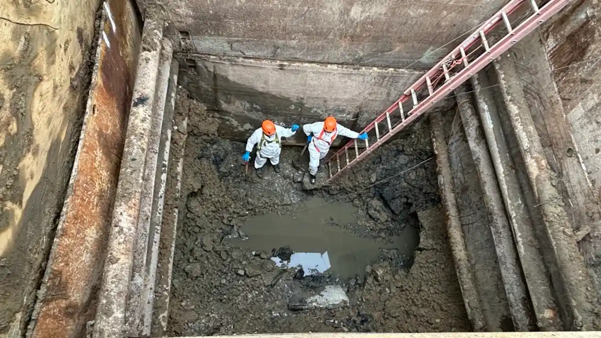 Workers inspect the collapsed section of the Potomac Interceptor sewer line during repair operations in Montgomery County, Maryland