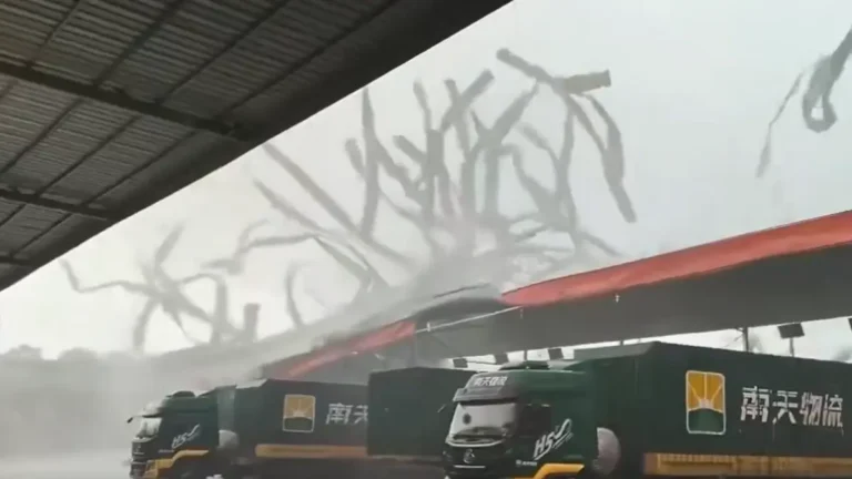 A tornado tears apart a warehouse roof in Xingning District, Nanning, Guangxi, China, on June 7, 2026