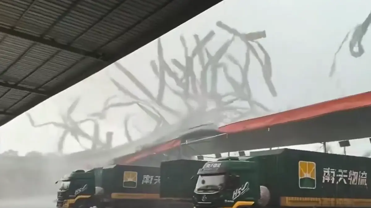 A tornado tears apart a warehouse roof in Xingning District, Nanning, Guangxi, China, on June 7, 2026