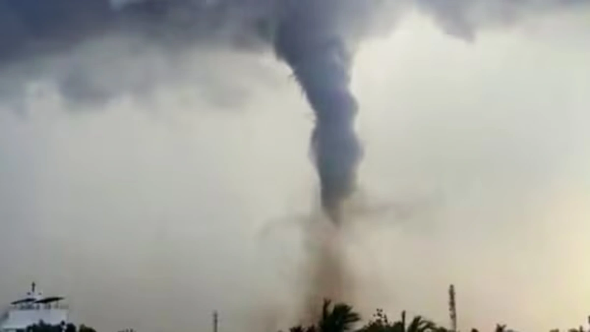 A tornado forms amid dark clouds, in Thoothukudi, Tamil Nadu, Sunday, June 21, 2026