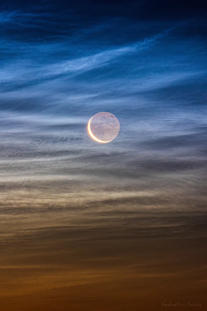 Late season noctilucent clouds and the crescent moon seen from Björköby (Korsholm municipality), Finland on August 21st 2025. Credit: Sebastian Sainio