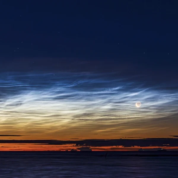 Late season noctilucent clouds and the crescent moon seen from Björköby (Korsholm municipality), Finland on August 21st 2025. Credit: Sebastian Sainio