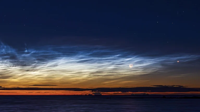 Late season noctilucent clouds and the crescent moon seen from Björköby (Korsholm municipality), Finland on August 21st 2025. Credit: Sebastian Sainio