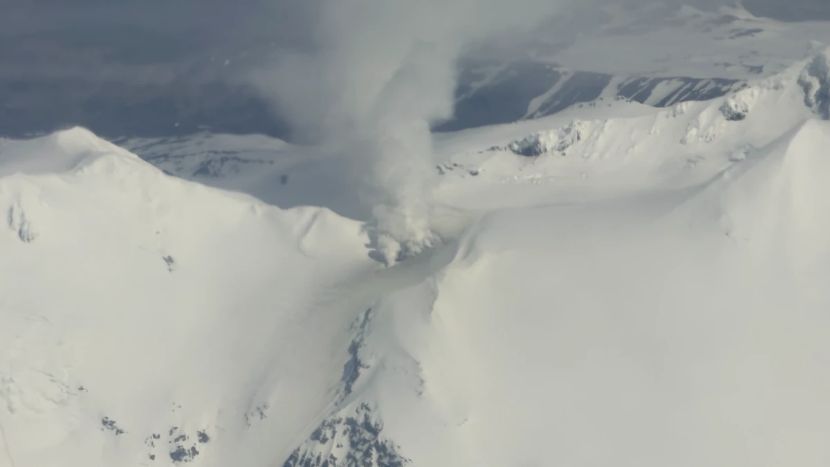 Vigorous steaming is visible from the persistently active fumarole field to the west of the summit of Mount Kupreanof in this oblique aerial photo taken on June 5, 2026. Although steaming in this location is typical, the degassing plume now contains more sulfur dioxide, indicating that magma has intruded to relatively shallow levels beneath the volcano. Credit: Carson Klemp.