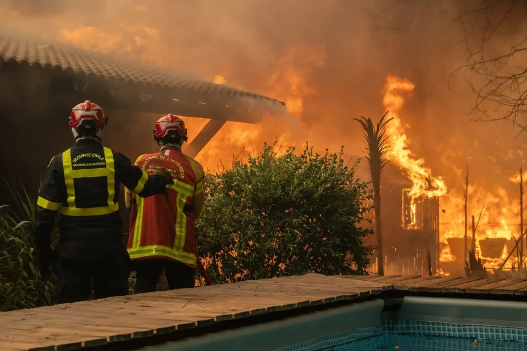 Firefighters battle a rapidly spreading wildfire near Lège-Cap-Ferret, Gironde, France, on July 24, 2026