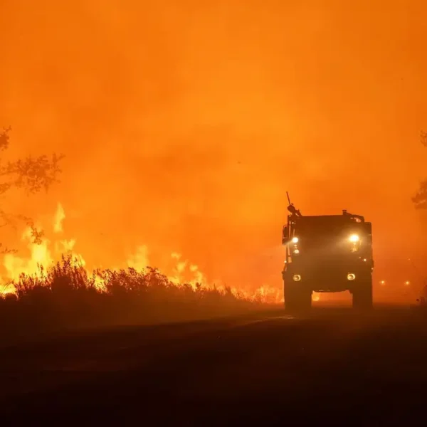 Firefighters battle a rapidly spreading wildfire near Lège-Cap-Ferret, Gironde, France, on July 24, 2026
