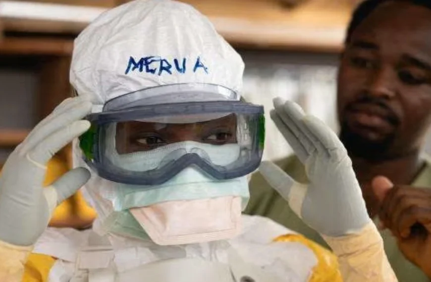 Healthcare workers prepare protective equipment as part of the Ebola response in the Democratic Republic of the Congo