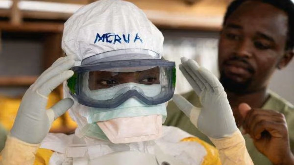 Healthcare workers prepare protective equipment as part of the Ebola response in the Democratic Republic of the Congo